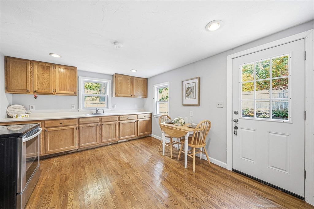 63 Juniper Road Holbrook, MA 02343 - Photo 16 of 35 a kitchen with stainless steel appliances granite countertop a sink and cabinets