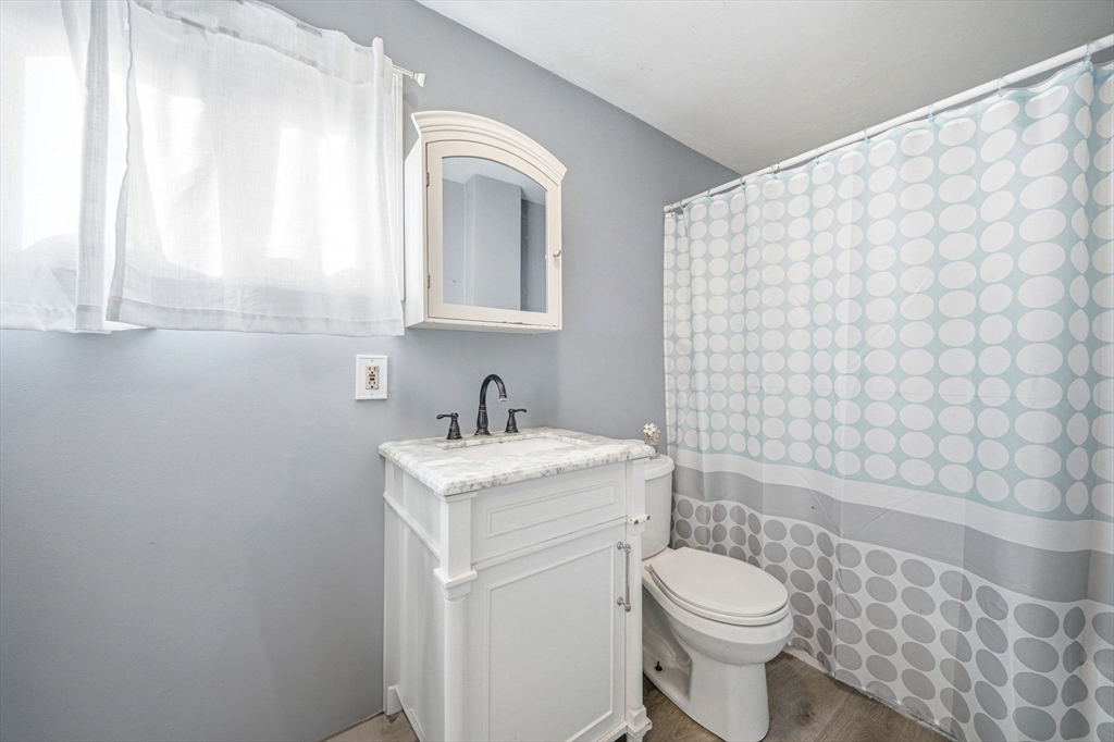 63 Juniper Road Holbrook, MA 02343 - Photo 28 of 35 a bathroom with a sink a toilet and shower