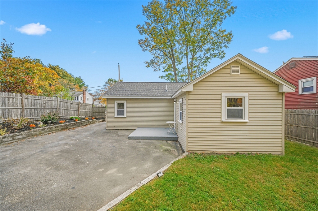 63 Juniper Road Holbrook, MA 02343 - Photo 31 of 35 a front view of a house with a yard and garage