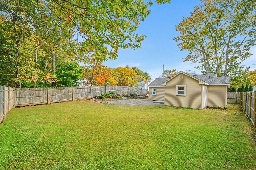 63 Juniper Road Holbrook, MA 02343 - Photo 32 of 35 a view of a house with a yard and fence
