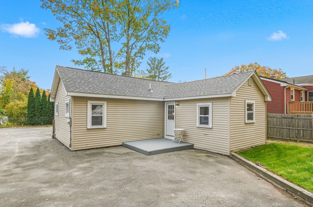 63 Juniper Road Holbrook, MA 02343 - Photo 33 of 35 a view of a house with a yard and garage