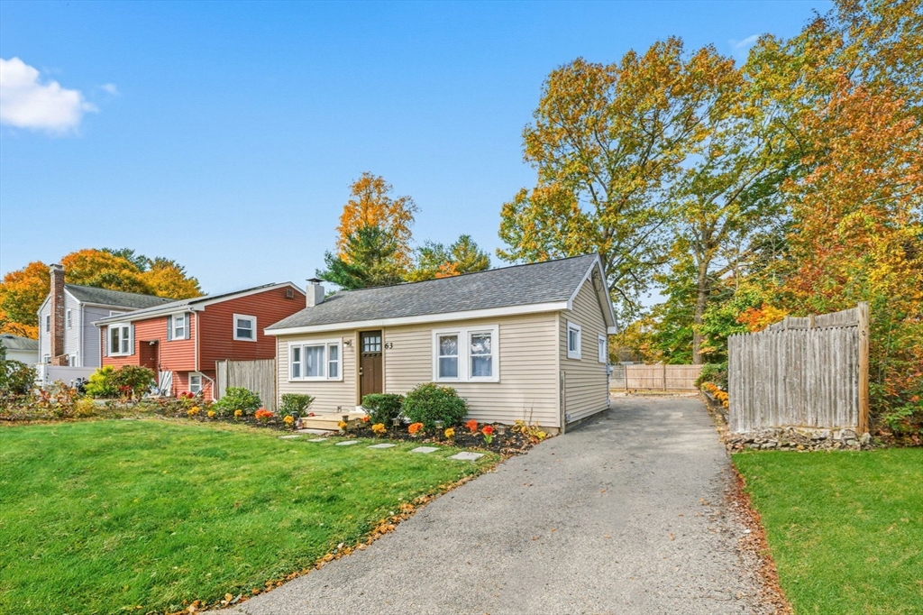 63 Juniper Road Holbrook, MA 02343 - Photo 34 of 35 a front view of house with yard and green space