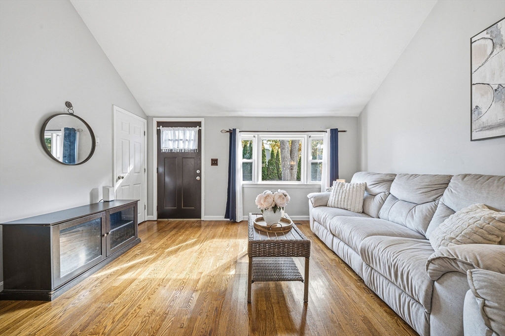 63 Juniper Road Holbrook, MA 02343 - Photo 6 of 35 a living room with furniture windows and a wooden floor