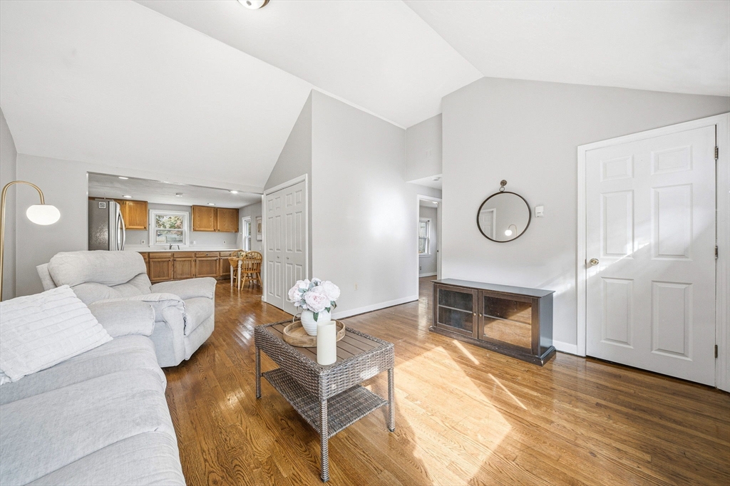 63 Juniper Road Holbrook, MA 02343 - Photo 7 of 35 a living room with furniture and a fireplace