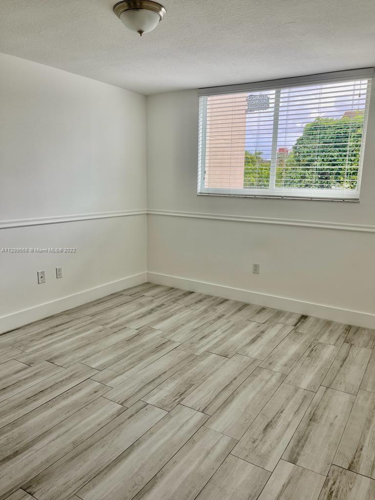 8050 Northwest 8th Street, Unit 201 Miami, FL 33126 - Photo 8 of 13 a view of a room that has a window