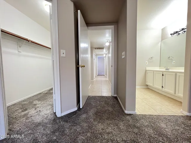 a view of a bathroom with mirror