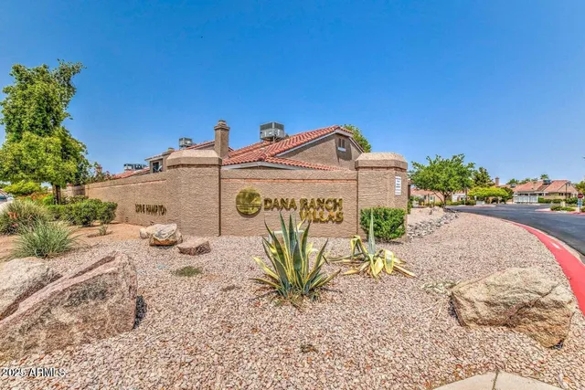 a view of a street with a building in the background