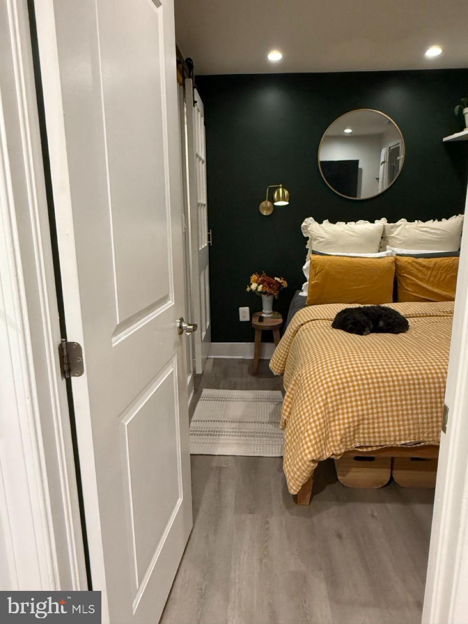 625 Park Road Northwest, Unit C8 Washington, DC 20010 - Photo 22 of 35 a bedroom with bed and a mirror