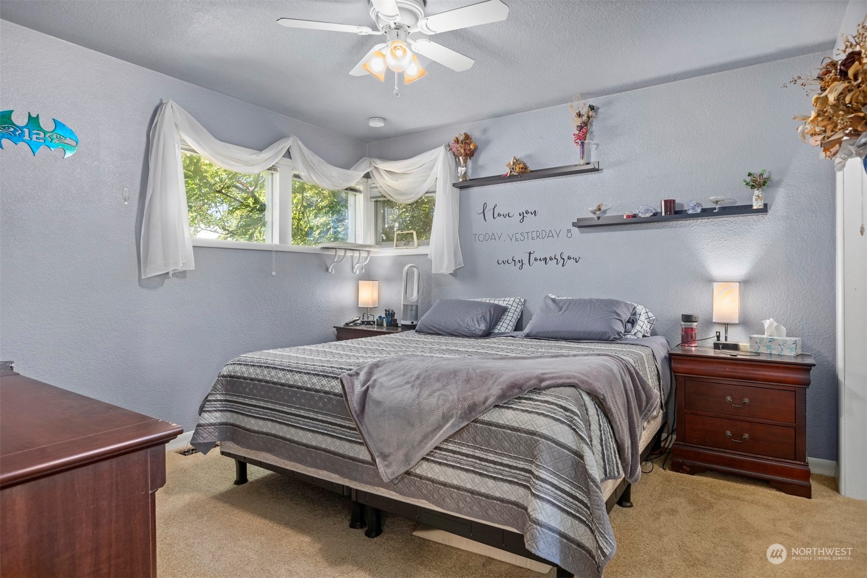 2275 Douglas Road Ferndale, WA 98248 - Photo 18 of 34 a bedroom with a bed and a chandelier
