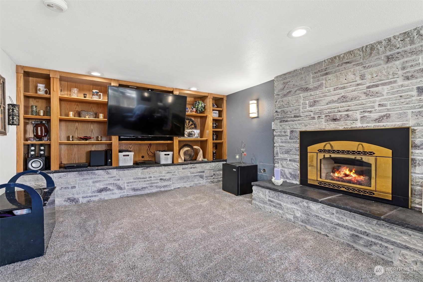 2275 Douglas Road Ferndale, WA 98248 - Photo 26 of 34 a living room with fireplace furniture and a flat screen tv