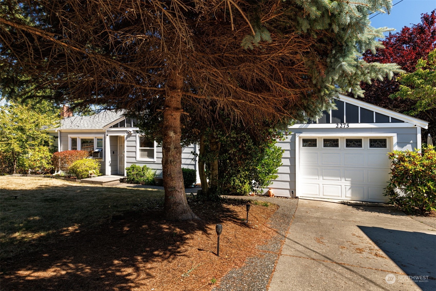 2275 Douglas Road Ferndale, WA 98248 - Photo 5 of 34 a front view of a house with a yard and a garage