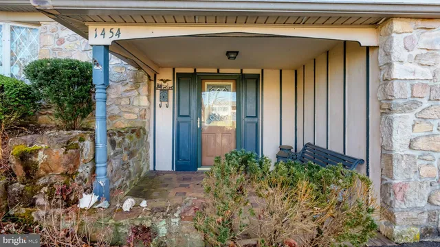 a front view of a house with a plants