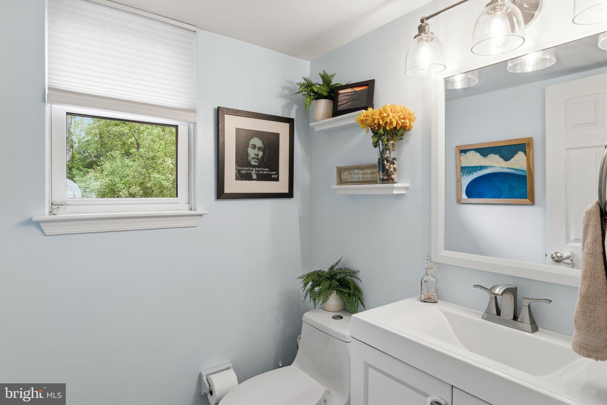2 Farnham Court Laurel Springs, NJ 08021 - Photo 21 of 33 a bathroom with a toilet a sink and mirror