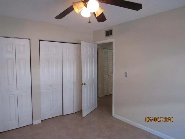 a bathroom with a toilet sink vanity tub and shower