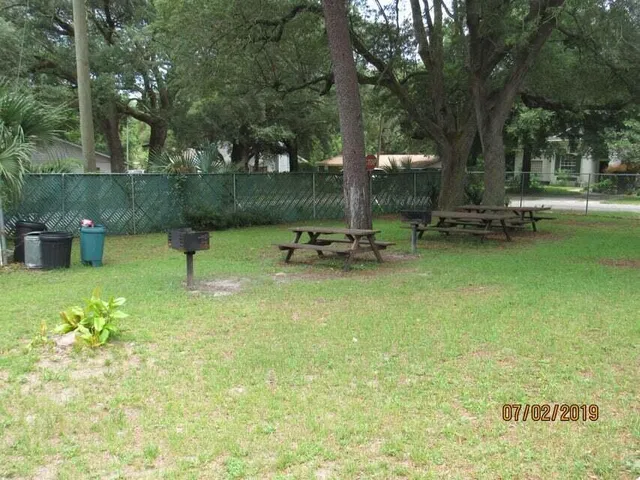 a view of a swimming pool with a chair