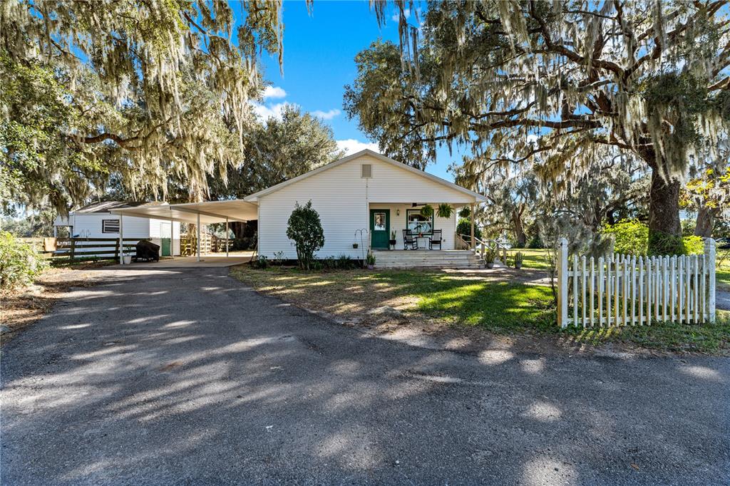 9504 Fort King Road Dade City, FL 33525 - Photo 45 of 51 a house view with a garden space