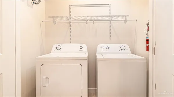 a utility room with dryer and washer