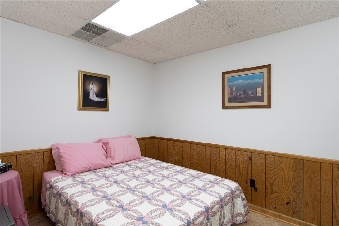 202 Plantation Point Anderson, SC 29625 - Photo 37 of 48 An inviting sleeping space with warm wood paneling and simple, clean walls.