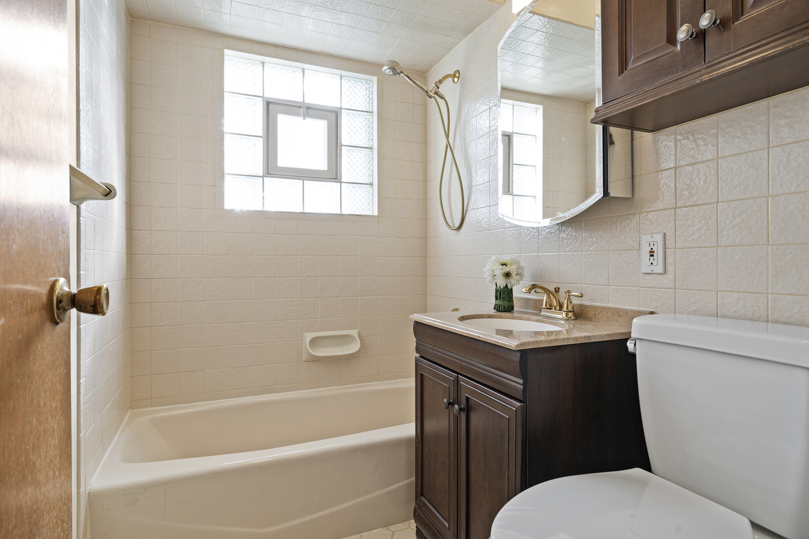 481 North Willow Road Elmhurst, IL 60126 - Photo 11 of 21 a bathroom with a granite countertop toilet sink and mirror