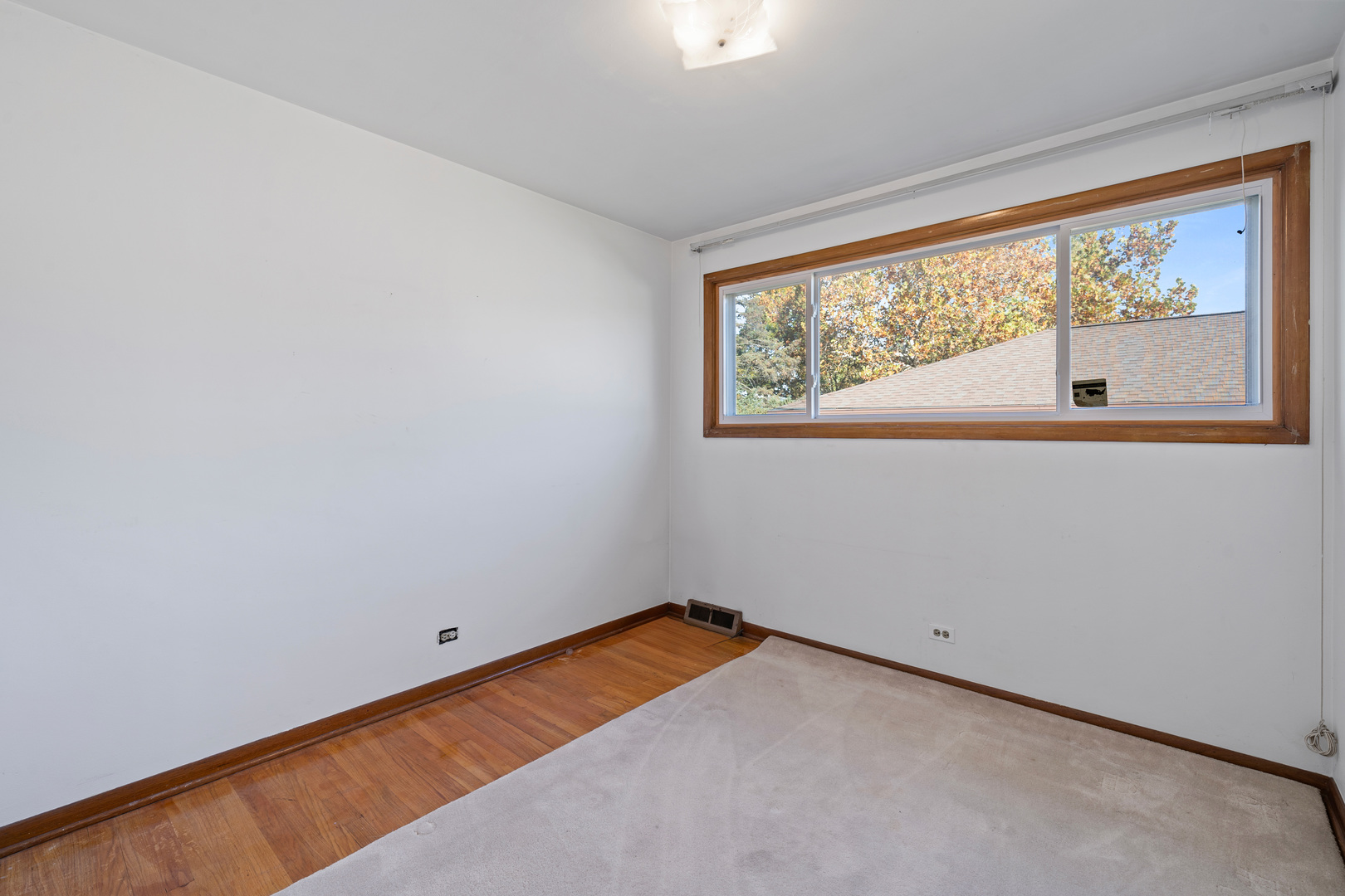 481 North Willow Road Elmhurst, IL 60126 - Photo 9 of 21 an empty room with a window