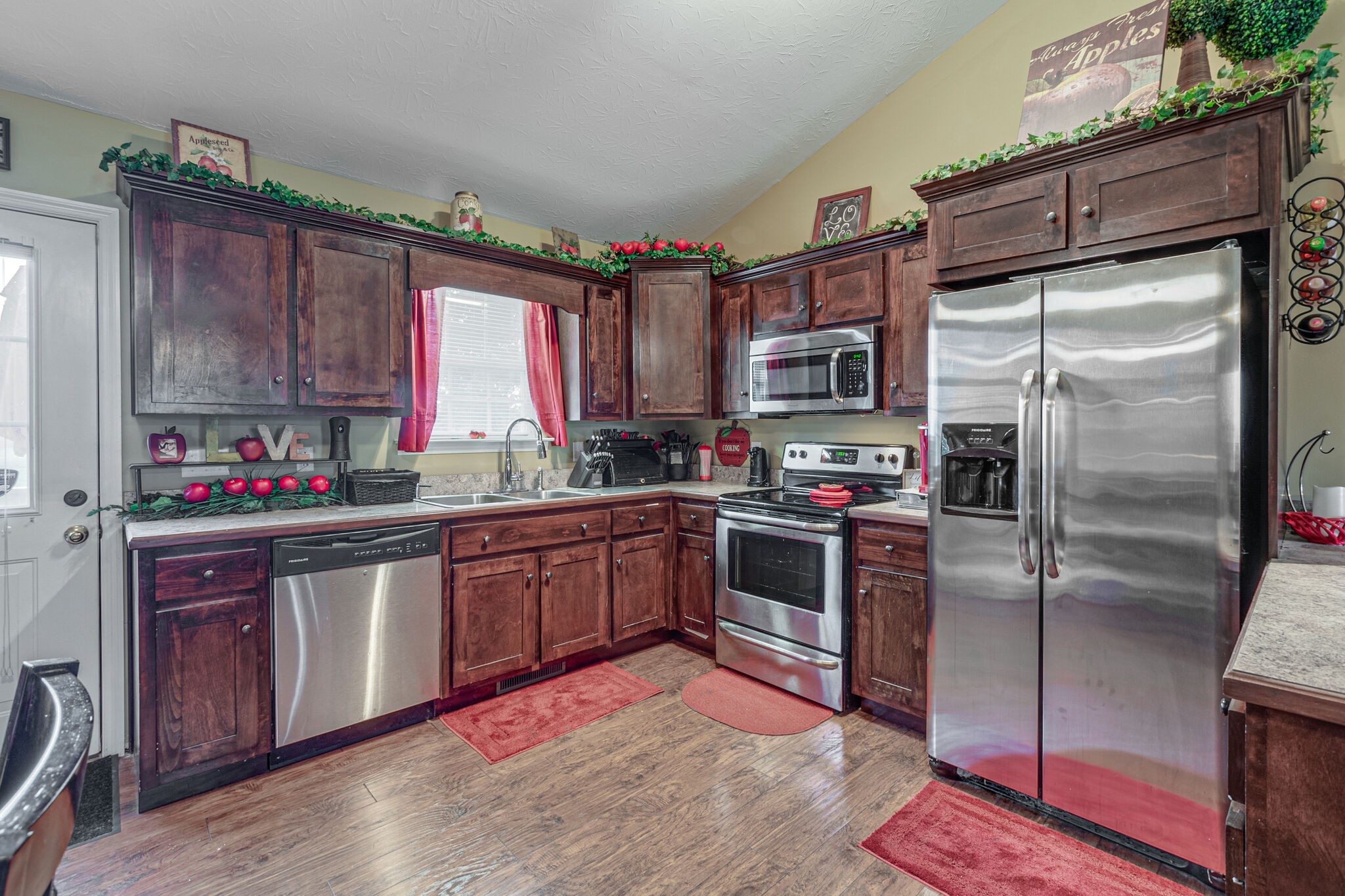 5 Roberts Lane Lebanon, TN 37087 - Photo 11 of 23 a kitchen with granite countertop a refrigerator stove top oven a sink and dishwasher