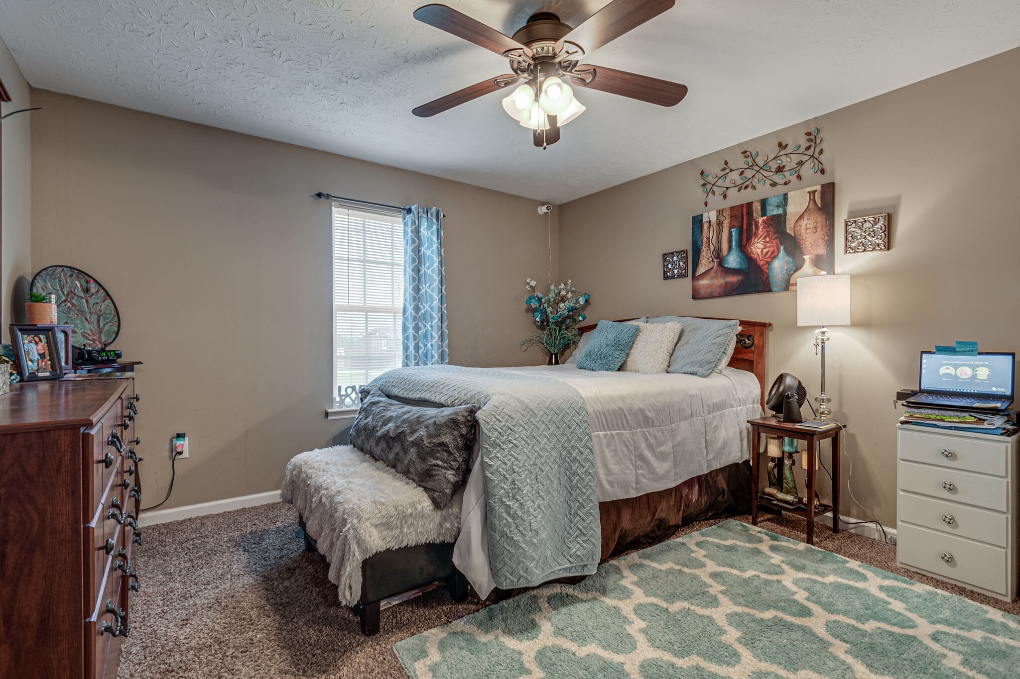 5 Roberts Lane Lebanon, TN 37087 - Photo 13 of 23 a bedroom with a bed and a chandelier