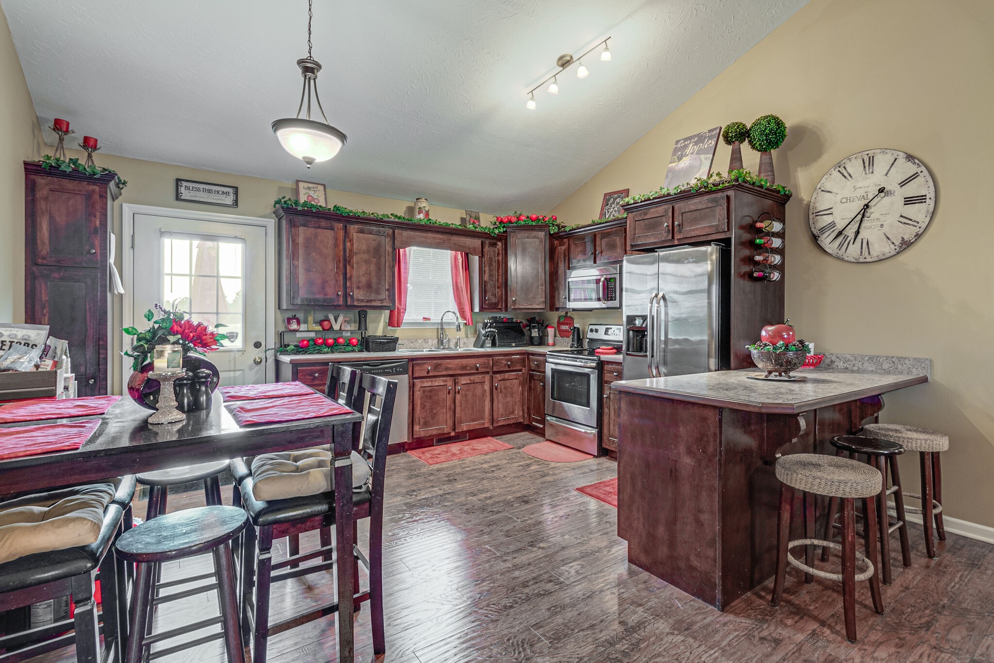 5 Roberts Lane Lebanon, TN 37087 - Photo 10 of 23 a kitchen with granite countertop a table chairs a stove a dining table and chairs