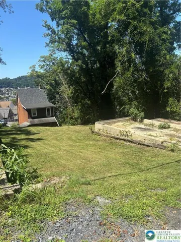 a view of a pool with an outdoor space