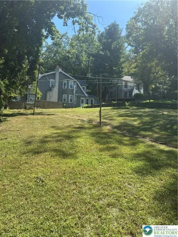 a view of a house with a swimming pool