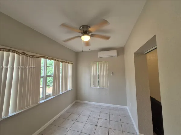 a view of an empty room with a window