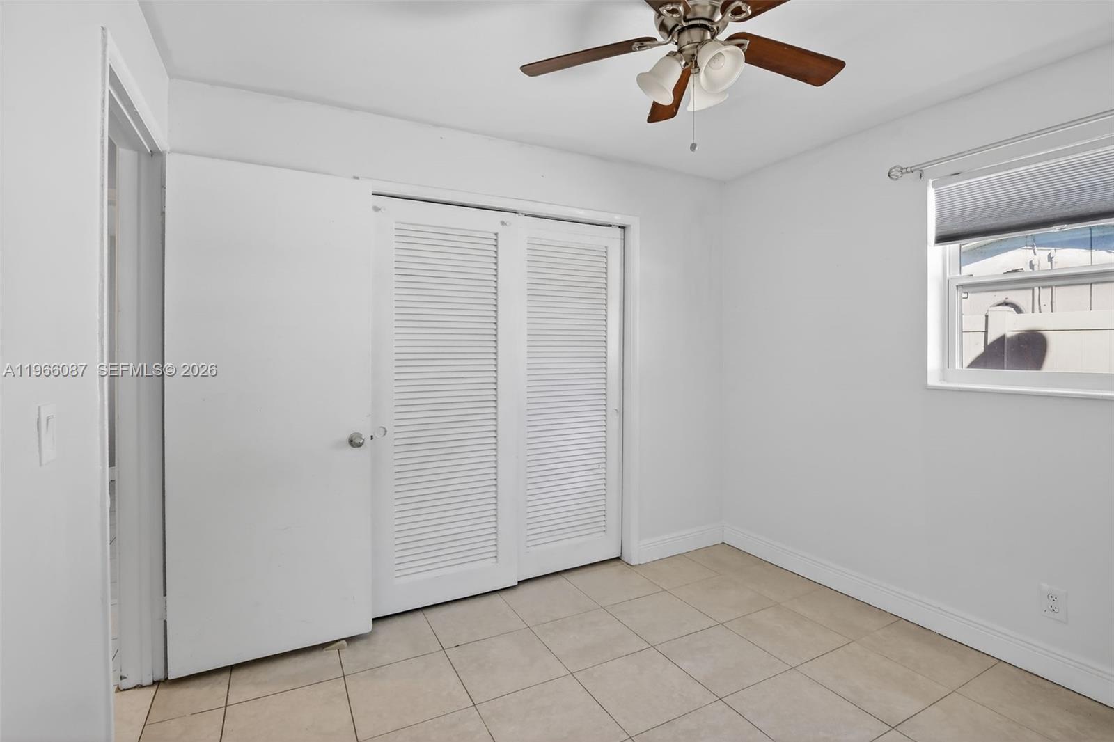 4998 Southwest 92nd Terrace Cooper City, FL 33328 - Photo 17 of 47 a view of an empty room with a window