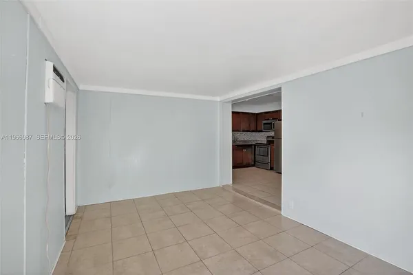 a view of an empty room and window