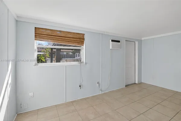 a view of an empty room with a window