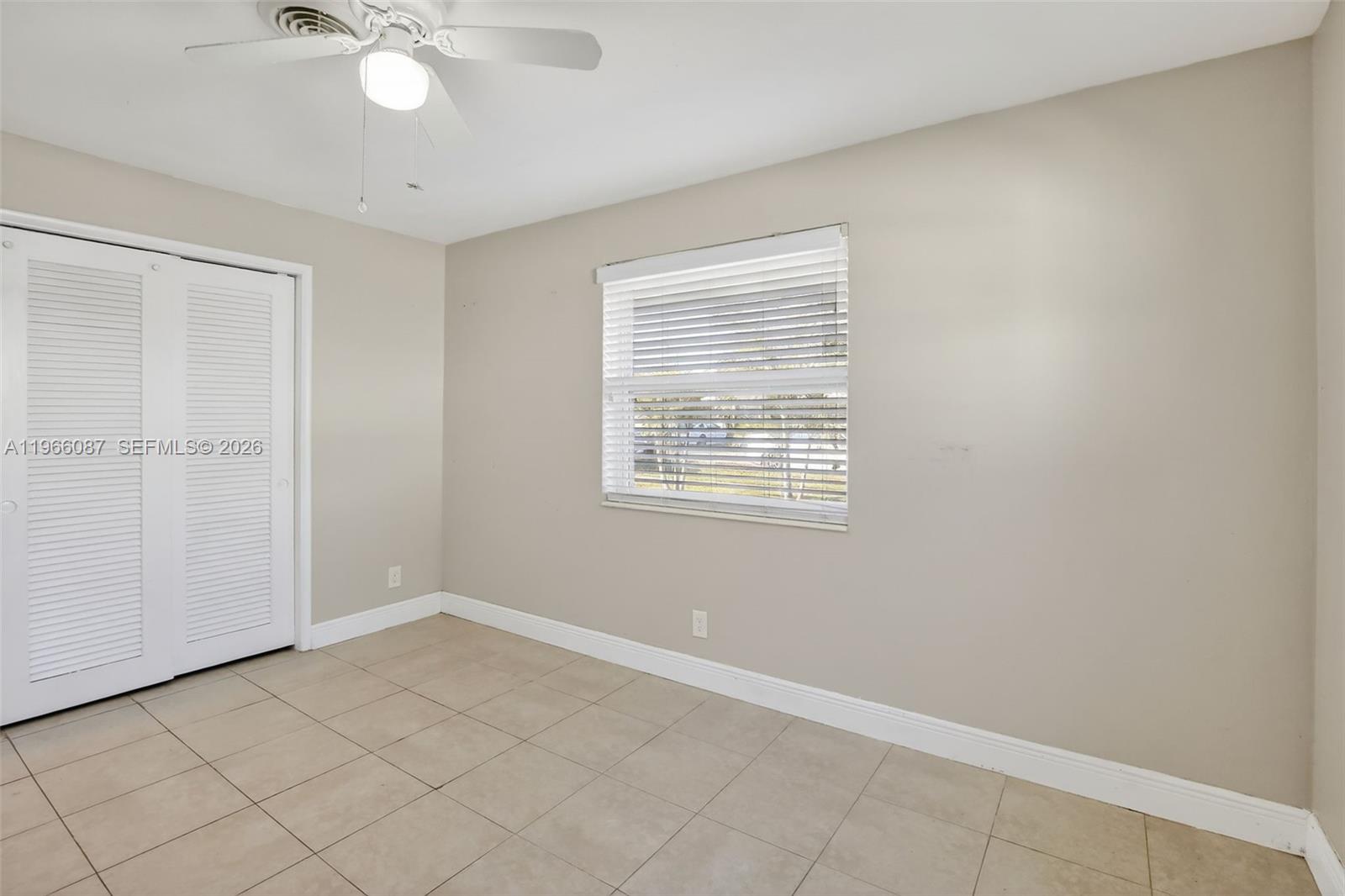 4998 Southwest 92nd Terrace Cooper City, FL 33328 - Photo 25 of 47 an empty room with a window
