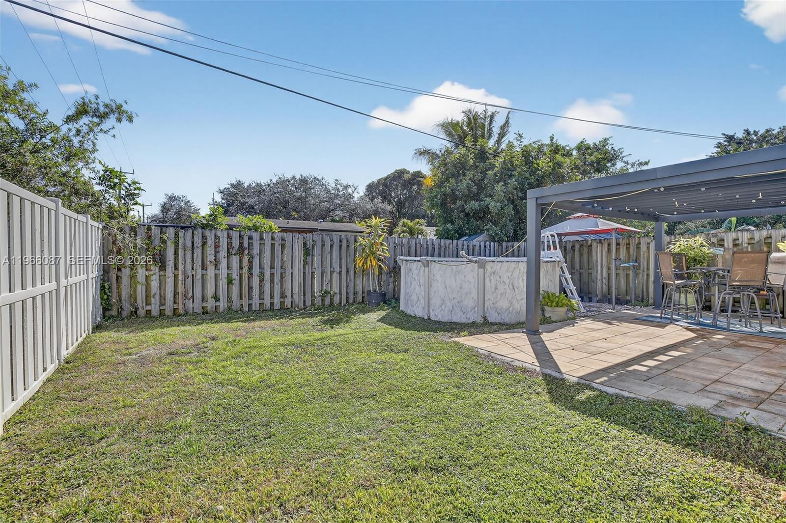 4998 Southwest 92nd Terrace Cooper City, FL 33328 - Photo 28 of 47 a view of a backyard with a slide