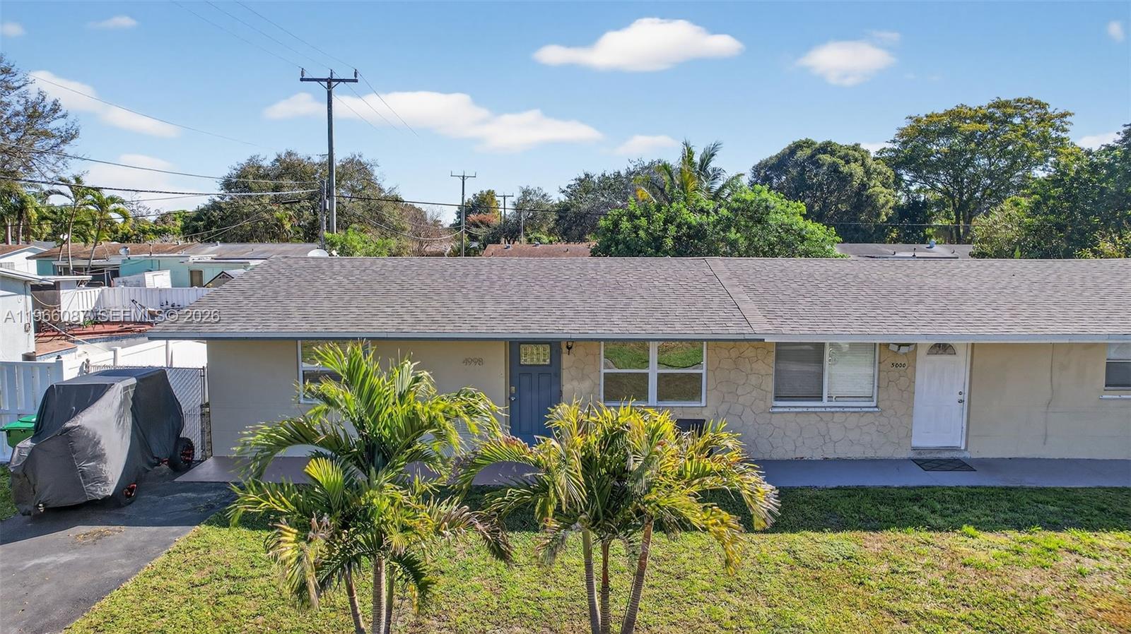 4998 Southwest 92nd Terrace Cooper City, FL 33328 - Photo 37 of 47 a front view of a house with a yard and potted plants