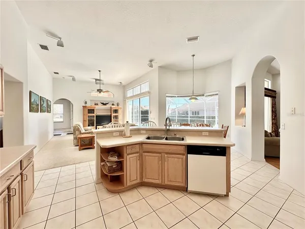 a kitchen with a sink and cabinets