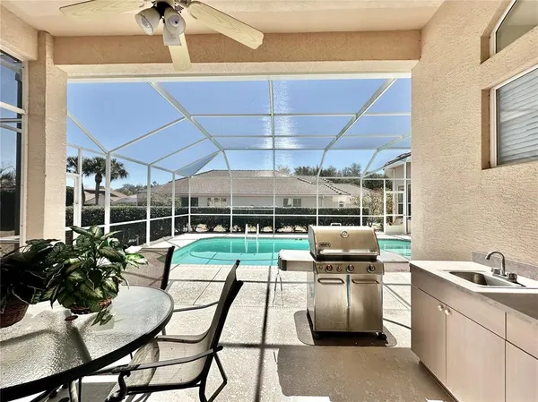 a kitchen with table and chairs