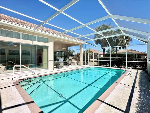 a view of a backyard with a patio and a garden
