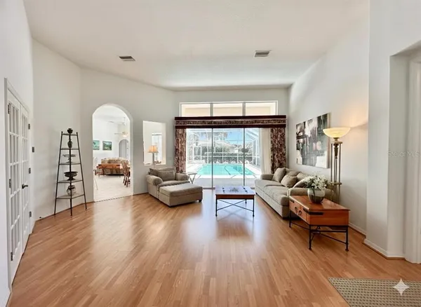 a living room with furniture and a large window