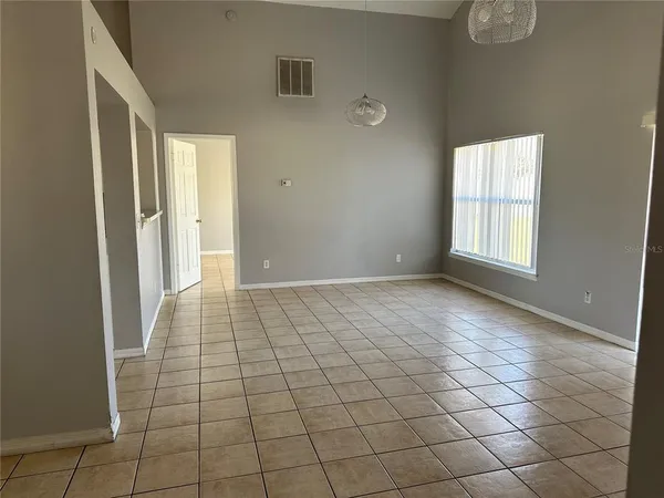 a view of an empty room and window