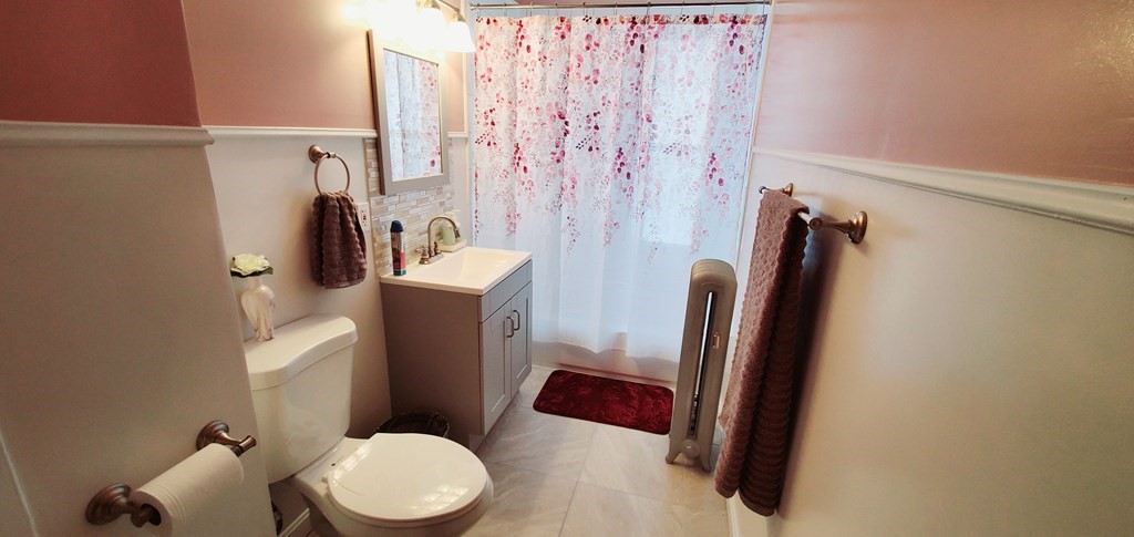 13 Whipple Street Worcester, MA 01607 - Photo 11 of 17 a bathroom with a toilet and a sink