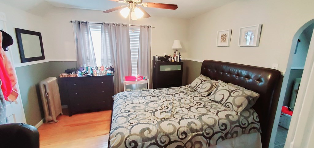 13 Whipple Street Worcester, MA 01607 - Photo 12 of 17 a bedroom with a bed and a dresser