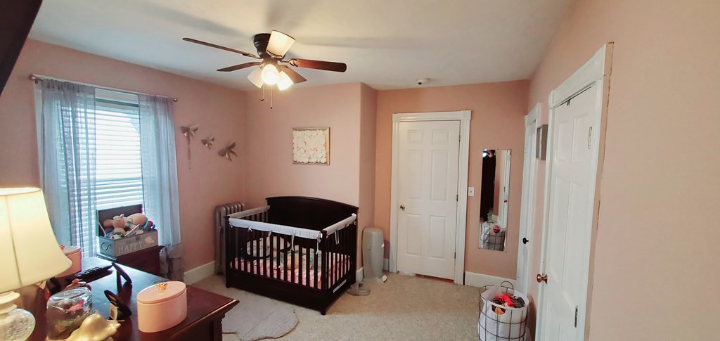 13 Whipple Street Worcester, MA 01607 - Photo 13 of 17 a bedroom with furniture and a window