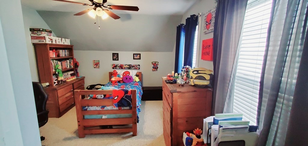 13 Whipple Street Worcester, MA 01607 - Photo 15 of 17 a bedroom with a bed and wooden floor