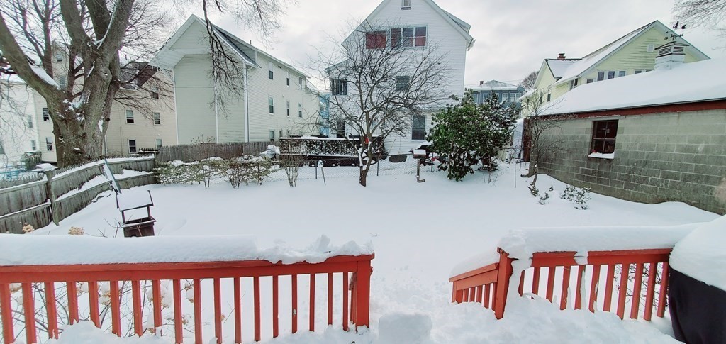 13 Whipple Street Worcester, MA 01607 - Photo 16 of 17 a backyard of a house with fire pit and outdoor seating