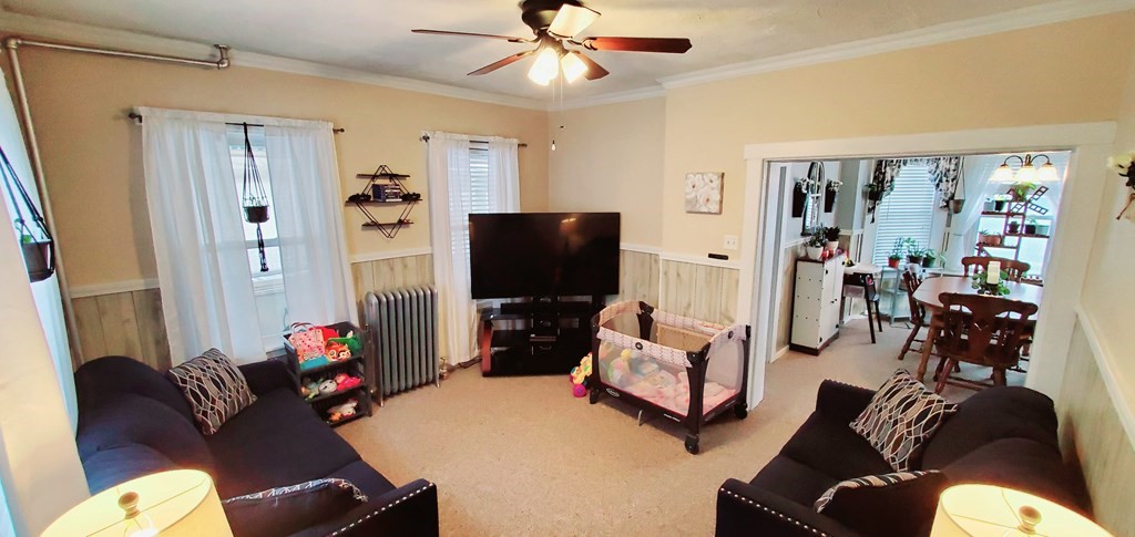 13 Whipple Street Worcester, MA 01607 - Photo 8 of 17 a living room with furniture and a flat screen tv