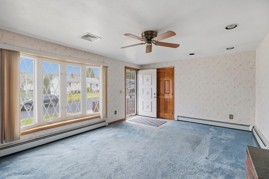 10 Deluca Road Milford, MA 01757 - Photo 5 of 37 a view of an empty room with a window