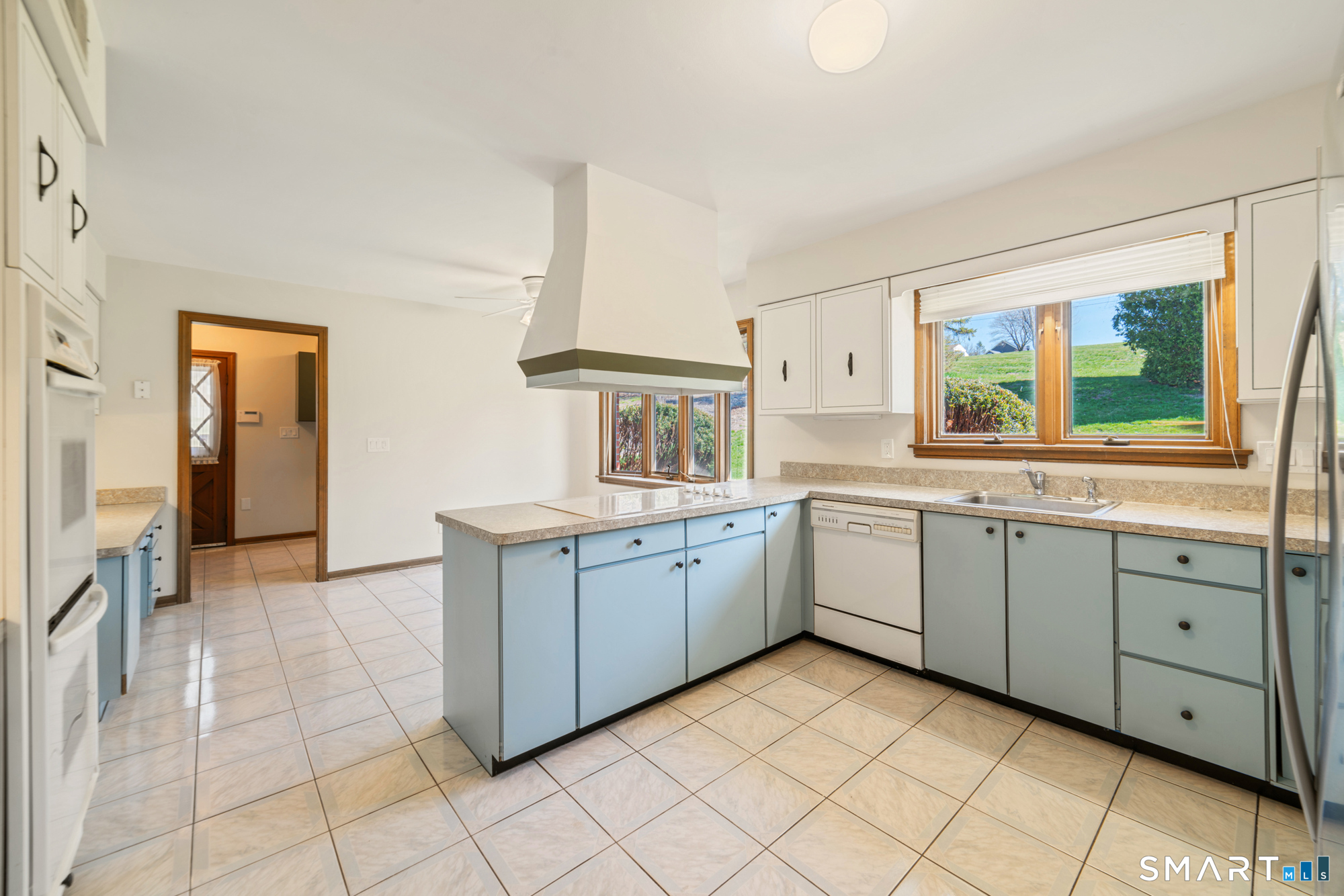 131 Sentinel Hill Road Derby, CT 06418 - Photo 7 of 40 a kitchen with sink cabinets and window
