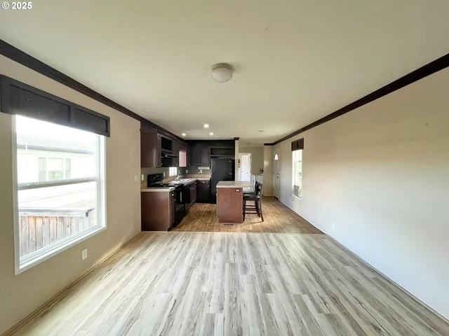 a view of a living room with a large window